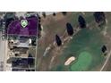 Aerial view of property with adjacent golf course, showcasing the home's location and landscaping at 9001 Sw 91St Cir, Ocala, FL 34481