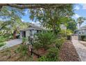 Quaint home with well-maintained front yard and mature foliage at 9001 Sw 91St Cir, Ocala, FL 34481