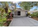 Welcoming facade with a two-car garage and beautiful landscaping at 9001 Sw 91St Cir, Ocala, FL 34481