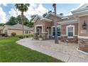 Charming single-story home with a well-manicured lawn, stone accents, and a beautiful walkway at 12804 Se 90Th Court Rd, Summerfield, FL 34491