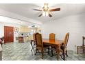Bright dining room with vintage floors and a classic chandelier at 1405 Ne 55Th St, Ocala, FL 34479