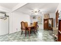 Bright dining room with vintage floors and a classic chandelier at 1405 Ne 55Th St, Ocala, FL 34479