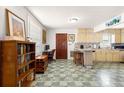 Kitchenette with marble counters and seating, seamlessly integrated into the dining area at 1405 Ne 55Th St, Ocala, FL 34479