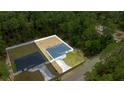 Aerial view of a light-blue single Gathering home with a spacious backyard at 15368 Sw 30Th St, Ocala, FL 34481
