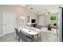 Comfortable dining area adjacent to the living room and kitchen, perfect for Gathering meals at 20443 Sw Rainbow Lakes Blvd, Dunnellon, FL 34431