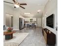 Bright and airy living area connected to the kitchen with modern appliances and dining space at 20443 Sw Rainbow Lakes Blvd, Dunnellon, FL 34431