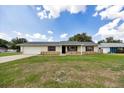 Charming single-story home featuring stone accents, a well-maintained lawn, and an attached one-car garage at 4331 Se 106Th Pl, Belleview, FL 34420