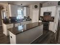Modern kitchen featuring granite countertops and stainless steel appliances at 4520 Se 28Th St, Ocala, FL 34480