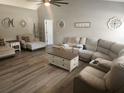 Bright living room featuring vaulted ceilings and stylish decor at 4520 Se 28Th St, Ocala, FL 34480