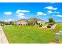 Well-maintained exterior with vibrant landscaping and a manicured lawn at 11871 Se 91St Cir, Summerfield, FL 34491