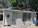 The back of this home shows a door and windows at 119 Lockhart St, Daytona Beach, FL 32114
