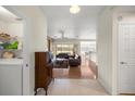 Open-concept living room with tile floors, flowing into dining area and featuring access to the patio at 4225 Sw 57Th Ave, Ocala, FL 34474