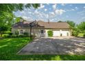 Features a basketball hoop and a three-car garage, perfect for recreational activities and parking at 4812 Se 12Th Pl, Ocala, FL 34471