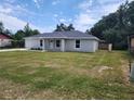 Lovely single-Gathering home featuring a lush green lawn and an attached garage at 541 56Th Ct, Ocala, FL 34482