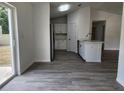 Open-concept kitchen with wood flooring and stainless steel appliances at 541 56Th Ct, Ocala, FL 34482