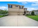 Spacious two-story home with a wide driveway and a two-car garage with stone accents at 8110 Sw 59Th Ter, Ocala, FL 34476