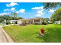 Lovely single-story home with a well-kept lawn and landscaping at 9891 Se 138Th Loop, Summerfield, FL 34491