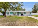Charming one-story home with a tidy front lawn and single car garage at 111 Almond Rd, Ocala, FL 34472