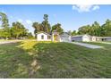 Well-maintained single-story home on a spacious lot with a long driveway at 12988 Se 42Nd Ct, Belleview, FL 34420