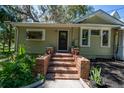 Inviting entrance with brick steps and established greenery at 20549 9Th St, Mc Intosh, FL 32664
