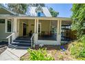 View of covered porch with columns and space for seating at 20549 9Th St, Mc Intosh, FL 32664