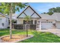 Charming home boasts a well-maintained lawn, attractive landscaping, and a welcoming two-car attached garage at 8785 Sw 93Rd Ln # C, Ocala, FL 34481