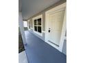 Welcoming front entrance with a freshly painted door, new frame and concrete at 14415 Sw 21St Pl, Ocala, FL 34481