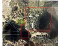 An aerial view of the property showing lakes, trees, and the boundaries at 17150 Se 168Th Ter, Weirsdale, FL 32195