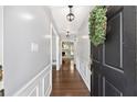 Inviting entryway with hardwood floors and decorative wainscoting at 1812 Se 38Th Ave, Ocala, FL 34471