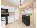 Well-lit kitchen with a cozy breakfast nook and modern appliances, great for Gathering meals at 2 Hemlock Trace Run, Ocala, FL 34472