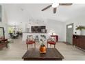 Open concept living room with breakfast bar, stylish furnishings, and lots of natural light at 3880 Sw 6Th Ave, Ocala, FL 34471