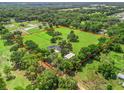 Aerial view of a large estate with mature trees surrounded by fencing at 402 Sw 127Th Pl, Ocala, FL 34473