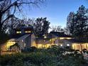 Contemporary two-story home with a three-car garage and illuminated in the night at 4305 Sw 20Th Ave, Ocala, FL 34471