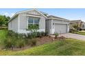Well-manicured lawn and landscaping enhance this attractive single-Gathering home at 4892 Nw 39Th Loop, Ocala, FL 34482