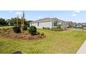 Lush lawn and landscaping surround this single-story home, enhancing its curb appeal and creating a welcoming atmosphere at 4892 Nw 39Th Loop, Ocala, FL 34482