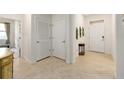 Bright foyer featuring tile flooring, white walls, and access to multiple rooms at 6265 Sw 88Th Loop, Ocala, FL 34476