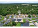 Aerial view of a residential neighborhood featuring well-manicured lawns and mature trees at 6680 Sw 179Th Court Rd, Dunnellon, FL 34432