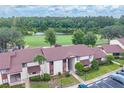 Scenic aerial view showcasing the community, lush greenery, and a beautiful serene lake at 688 Midway Dr # B, Ocala, FL 34472