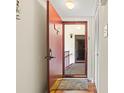 Open front door reveals a glimpse of the interior with wood floors and staircase at 688 Midway Dr # B, Ocala, FL 34472