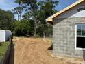 Exterior view showcasing a spacious backyard ready for landscaping and outdoor activities at 85 Nw 45Th Loop, Ocala, FL 34475