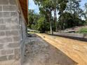 View of the yard with the concrete block walls, awaiting landscaping at 85 Nw 45Th Loop, Ocala, FL 34475