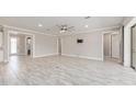 Spacious living room with tile flooring, neutral paint, recessed lights and open access to other areas of the home at 9777 Sw 63Rd Loop, Ocala, FL 34481