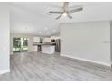 Open-concept kitchen featuring an island, stainless steel appliances, and seamless access to the living area at 174 Pine Crse, Ocala, FL 34472