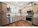 Well-equipped kitchen featuring stainless steel appliances, granite countertops, ample cabinet space, and stylish backsplash at 1839 Cr 543A, Sumterville, FL 33585