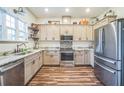 Modern kitchen featuring stainless steel appliances, granite countertops, and ample storage, perfect for culinary enthusiasts at 1839 Cr 543A, Sumterville, FL 33585