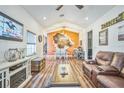 Spacious living room showcasing wood floors, modern decor, and an open layout ideal for entertaining and Gathering gatherings at 1839 Cr 543A, Sumterville, FL 33585