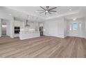 Open concept kitchen with bright lighting, stainless appliances, and spacious countertops at 2050 Nw 79Th Loop, Ocala, FL 34475