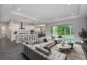Bright living area with plush seating, neutral color palette, and a view of the outdoors at 2050 Nw 79Th Loop, Ocala, FL 34475