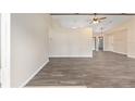 Bright, open living space featuring wood-look flooring and neutral paint at 2819 Ne 32Nd Pl, Ocala, FL 34479