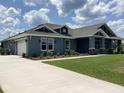 Charming single story home featuring a well-manicured lawn and an attached two car garage at 8290 Nw 17Th Cir, Ocala, FL 34475